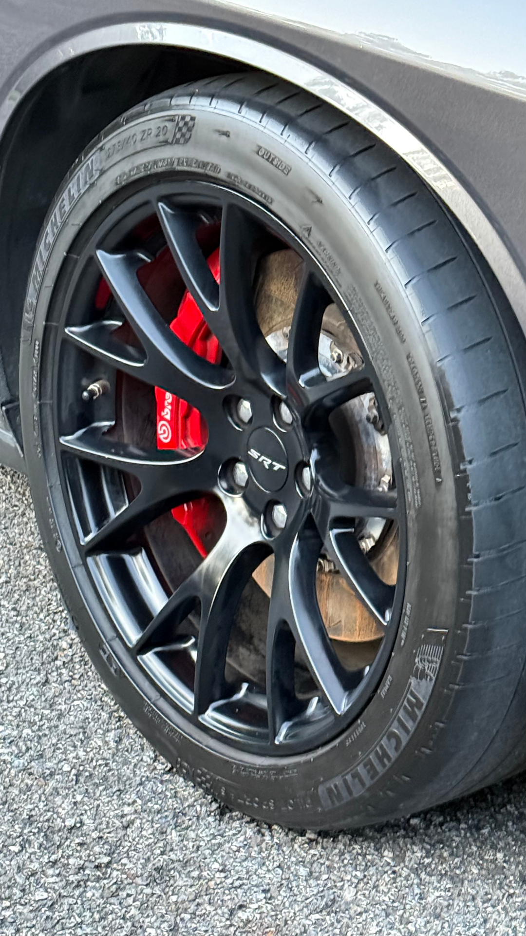 Signature Detail close-up of black SRT wheel and red brake caliper